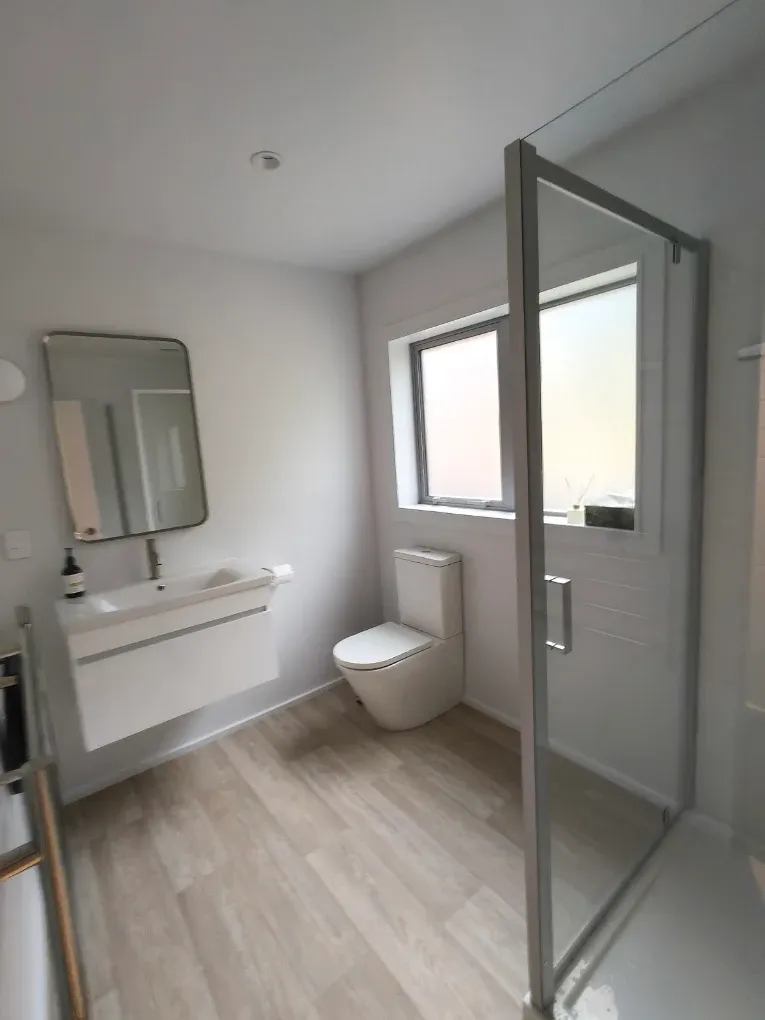 Bathroom with vanity, mirror and freshly painted walls